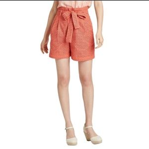 A new day high waisted, eyelet shorts in coral. Size 8. Like new.